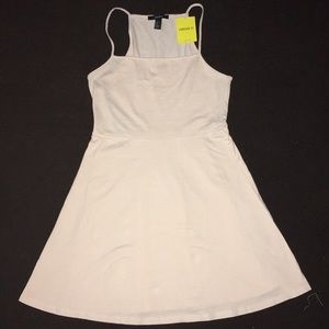 A beige, fit and flare dress.